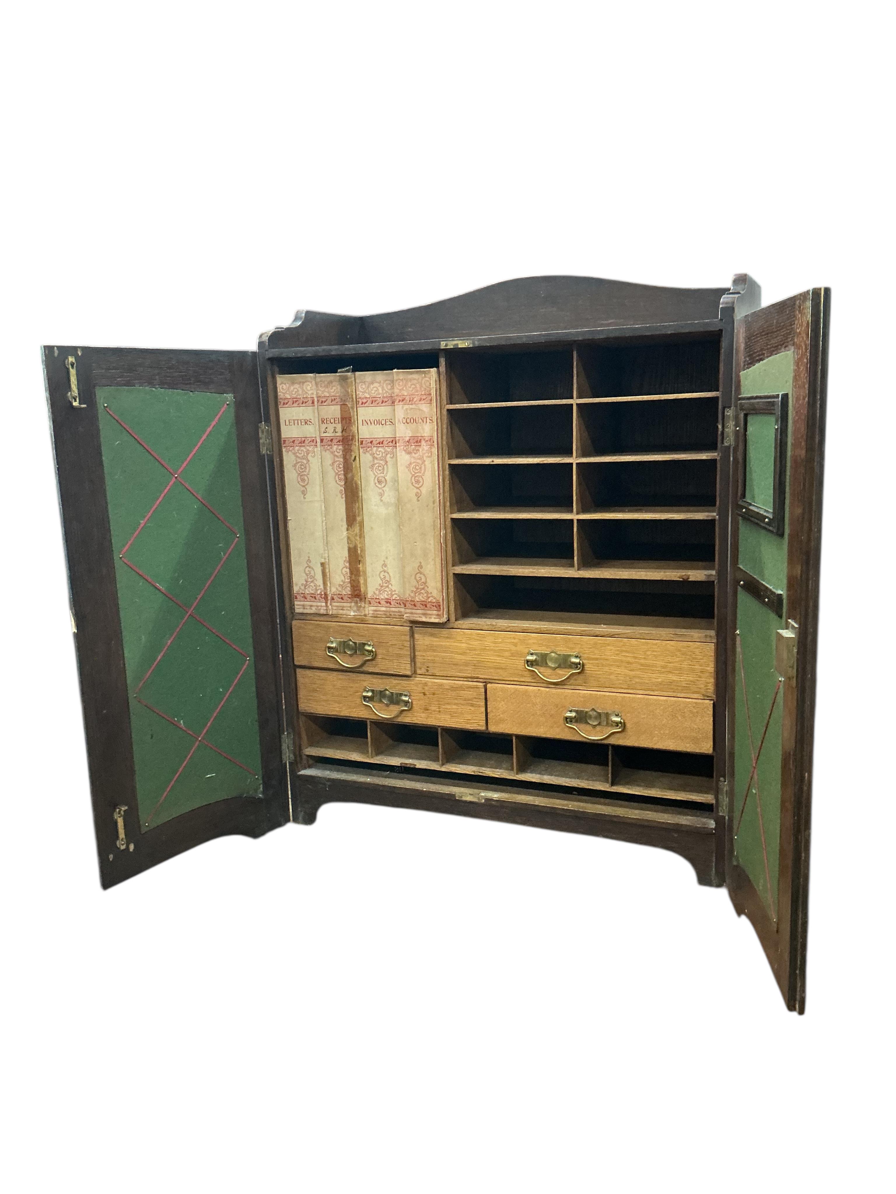 An Edwardian oak stationery cabinet, width 57cm, depth 29cm, height 72cm